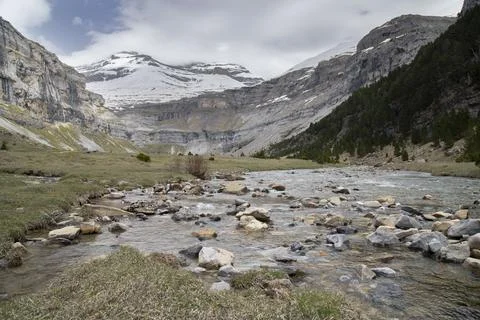 Ordesa valley river flowing through pyrenees mountain landscape Stock Photos