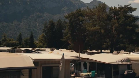 Ordinary camping in Switzerland against backdrop of Swiss Alps, many tent houses Stock Footage 320825908