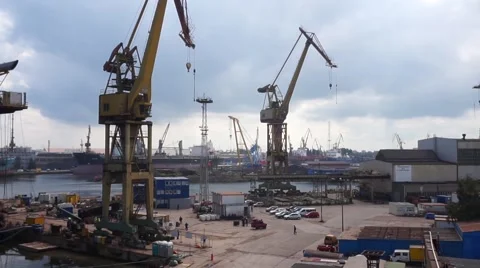 Ordinary working day in a shipyard. Shipyard cranes Stock Footage 64804139