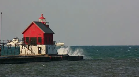 Ore ship passing by lighthouse Stock Footage 12183756