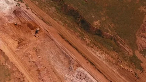 Ore storage. Excavator loads ore. Bird's eye view Stock Footage 73423900