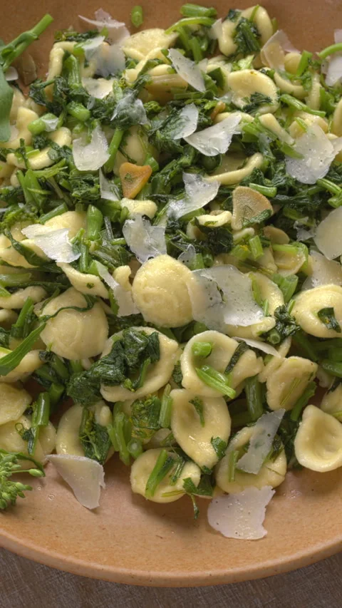 Orecchiette pasta with rapini. Vertical video. Stock Footage 311799433