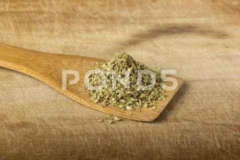 Oregano In A Wooden Spoon