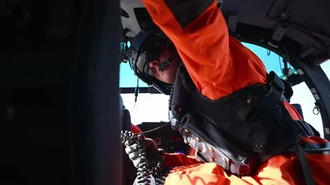 OREGON - 5.9.2025 - US Coast Guardsmen adjust their gear in a helicopter. Stock Footage 312863256