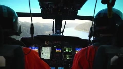 OREGON - 5.9.2025 - US Coast Guardsmen fly a helicopter up a forested river in Stock Footage 312863690