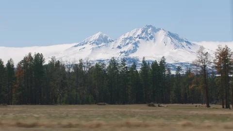 Oregon circa-2020.  Stabilized driving shot of Sisters Mountains outside of Stock Footage