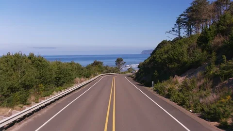 Oregon circa-2020.  Stabilized driving shot of road along Oregon Coast.  Shot Stock Footage 130358896