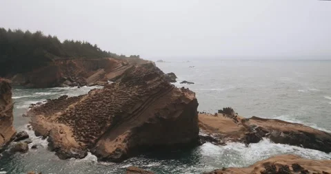 Oregon Coast, waves hit huge rock Stock Footage 284294470