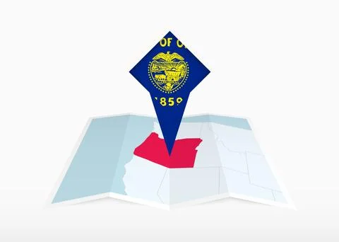 Oregon is depicted on a folded paper map and pinned location marker with fl.. Stock Illustration