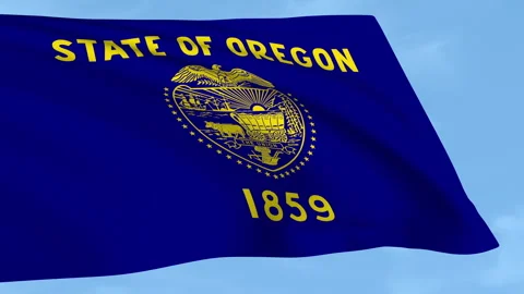Oregon flag waving on a clear blue sky Stock Footage 323637439