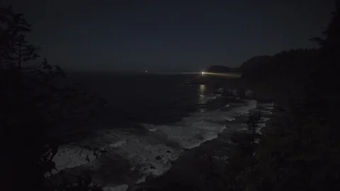 Oregon - Lighthouse along Ocean at Night with Waves and Stars - 4K Realtime Stock Footage 113119464
