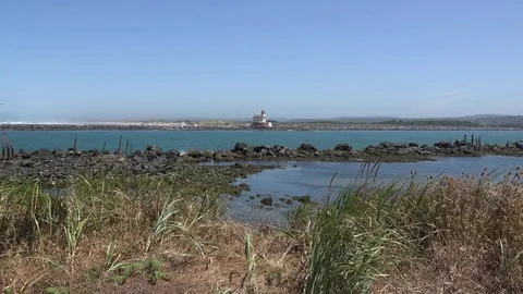 Oregon lighthouse at Bandon on Coquille River Stock Footage