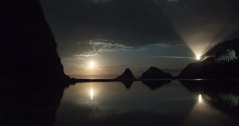 Oregon - Lighthouse at Night with Moon Setting Ocean - 4K Timelapse Stock Footage 113463327