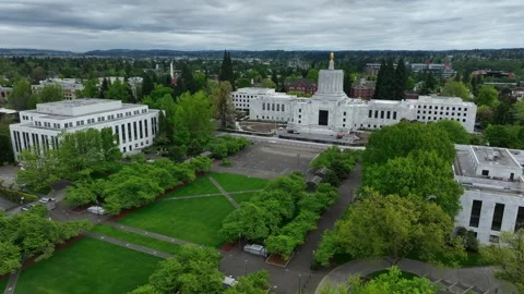 Oregon State Capitol building in Salem surrounded by green park paths and Stock Footage 334605717