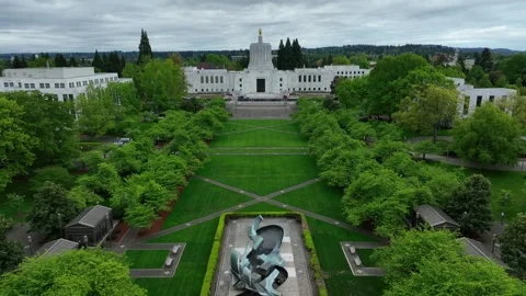 Oregon State Capitol building in Salem with iconic golden Pioneer statue atop Stock Footage 334998201