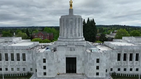 Oregon State Capitol in Salem with gold Pioneer statue atop Art Deco dome with Stock Footage 335263984