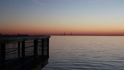 Oresund bridge in sunset with plane passing by 動画素材 75685955