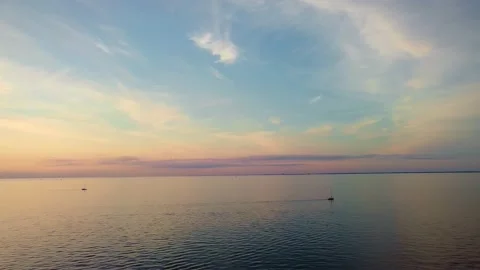 Oresund at sunset. Staticish camera showing some boats on the see Stock Footage 136726074