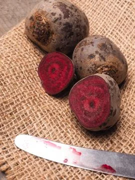 Organic beet root on rustic background Stock Photos