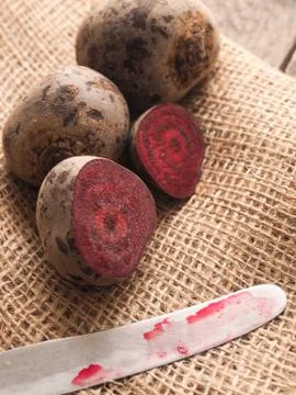 Organic beet root on rustic background Stock Photos