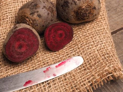 Organic beet root on rustic background Stock Photos