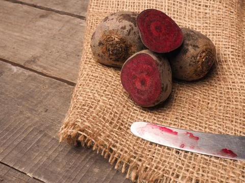 Organic beet root on rustic background Stock Photos