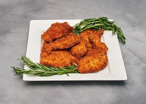 Organic breaded chicken cutlet Stock Photos