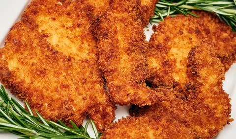 Organic breaded chicken cutlet Stock Photos