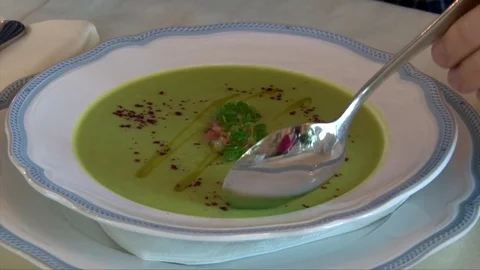 Organic Broccoli Soup - Top View of Man Han Eating Soup with a Spoon Video stock 72301095