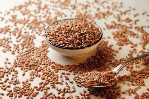 Organic brown rice creates a rustic culinary backdrop in a kitchen setting Stock Photos