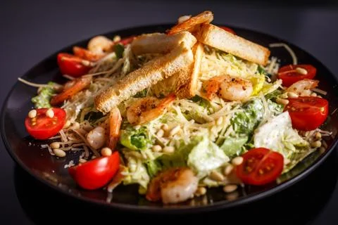 Organic caesar salad with caesar dressing. International food. Stock Photos