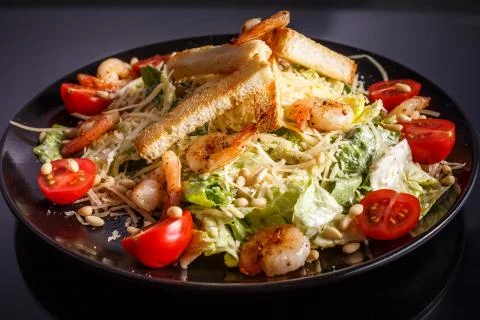 Organic caesar salad with caesar dressing. International food. Stock Photos