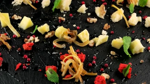 Organic cheese platter with walnut, fried onions and cranberry, loop Video stock 66482664