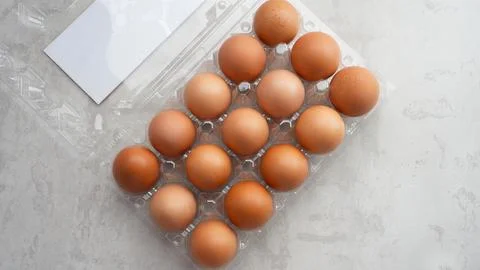 Organic chicken eggs in plastic packaging Stock Photos