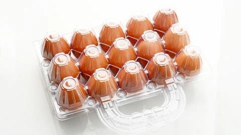 Organic chicken eggs in plastic packaging Stock Photos