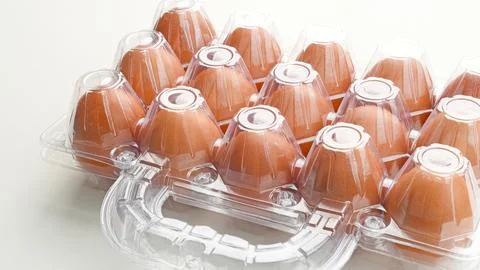 Organic chicken eggs in plastic packaging Stock Photos