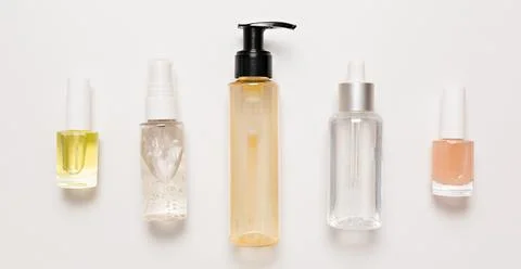Organic cosmetics packaging design. Flat lay, top view clear glass pump bottl Stock Photos