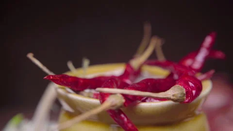Organic dried red chilies in a ceramic container isolated on a black background  Stock Footage 340989861