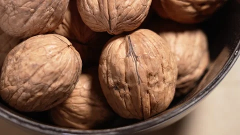 Organic dried walnuts in ceramic bowl Stock Footage 330941763