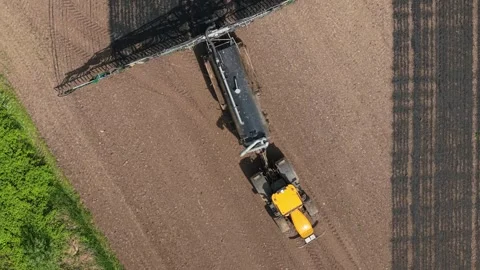 Organic fertilizer application tractor turning in agricultural field. Liquid Video stock 336717845