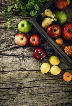 Organic fruit on wood.Rustic setting Stock Photos