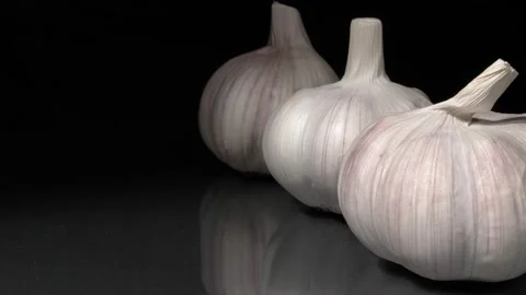 Organic garlic close-up on a black background. Stock Footage 144352718