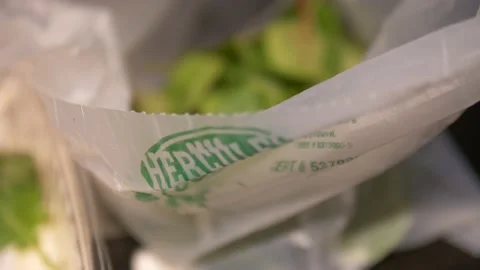 Organic greens been put in the compost recycling Stock Footage 131502630