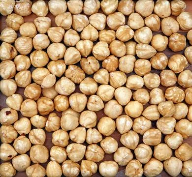 Organic Hazelnut. For texture or background. Stock Photos