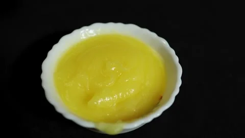 Organic homemade ghee presentation featuring creamy texture and rich dairy .. Stock Footage 336646062