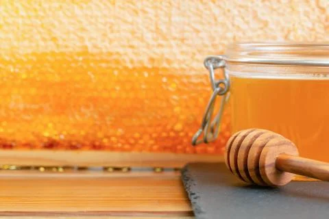 Organic honey and rustic bread on a old wooden table. Healthy eating breakfas Stock Photos