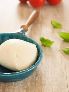 Organic mozzarella with basil Stock Photos