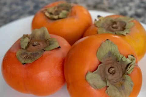 Organic Persimmons Foto stock