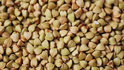 Organic raw buckwheat grains texture. Buckwheat Background. Healthy food concept Stock Footage 315754282