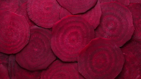Organic red beetroot slices background. Fresh colorful organic beetroot texture Stock Footage 318875554